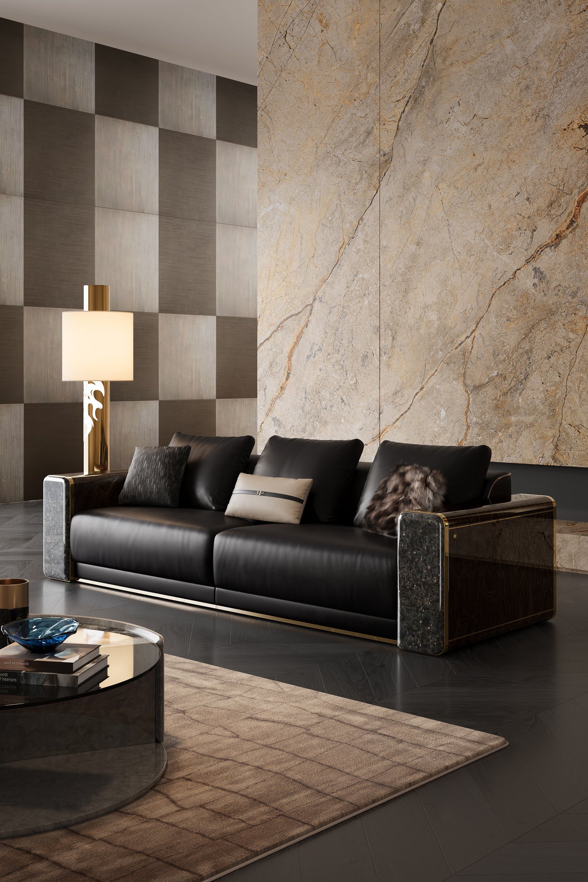 Front-side view of the luxury black leather Mirelano Nares Sofa, styled in front of a golden-veined marble wall and brass floor lamp.