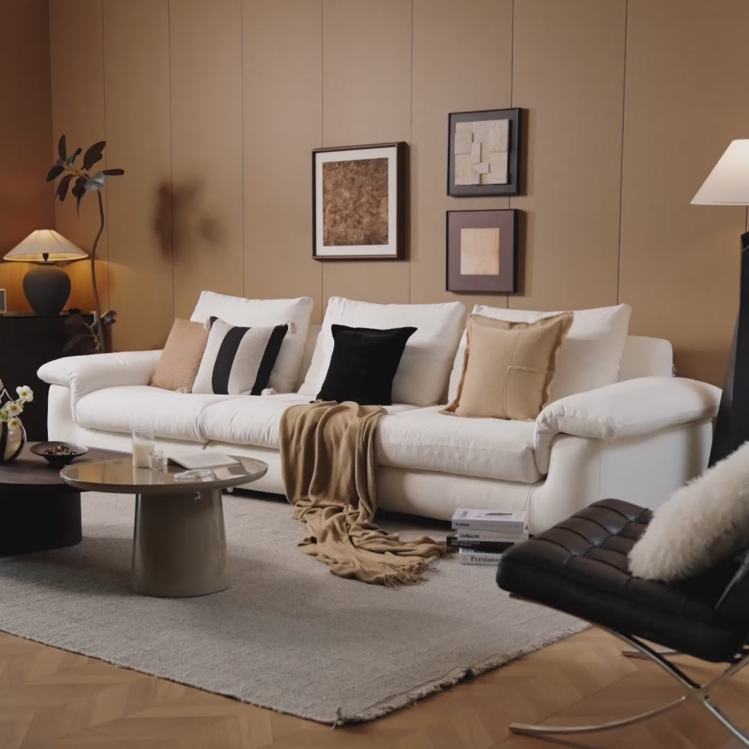 Load video: Close-up view of MIRELANO cloud sofa showcasing its fabric texture and refined upholstery details