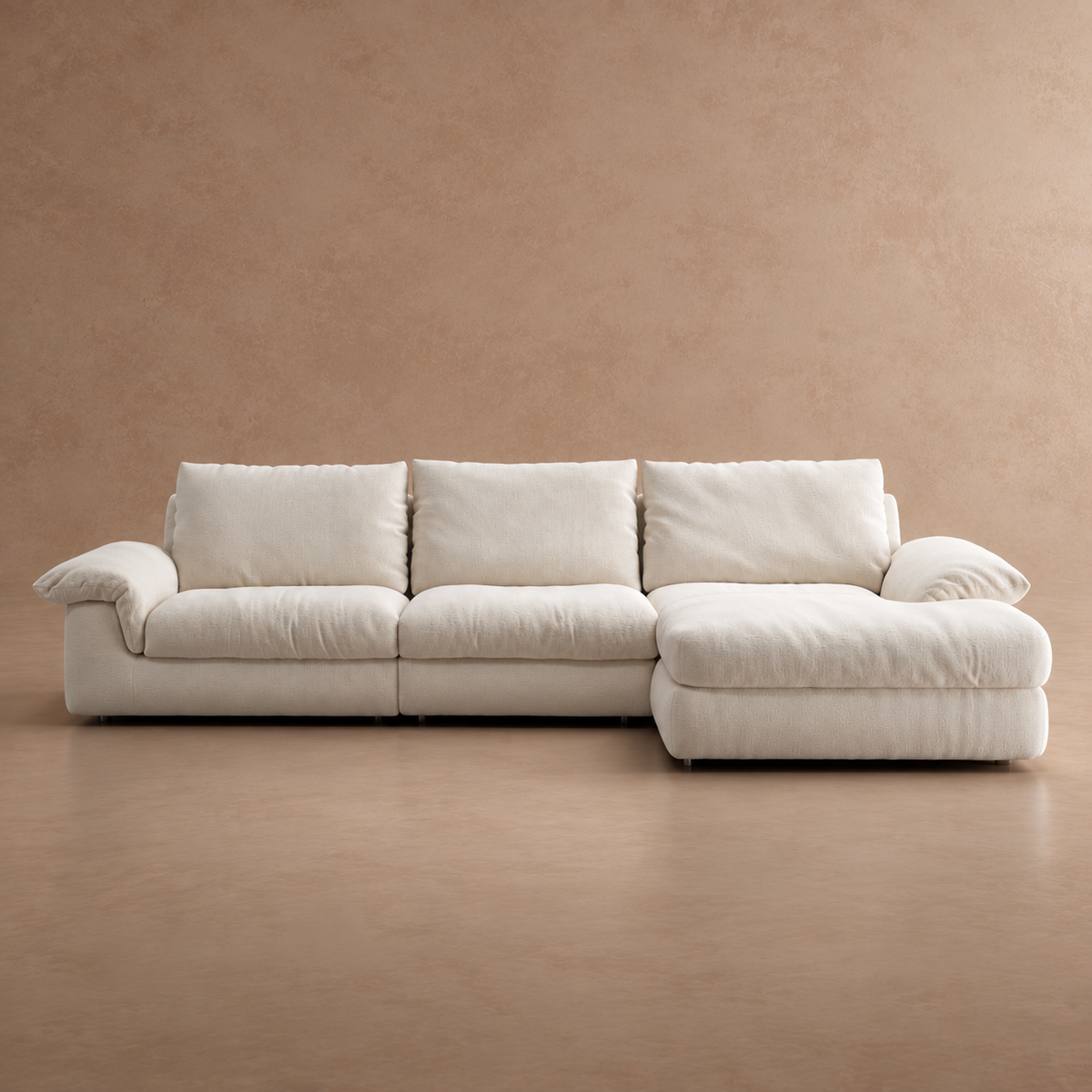 Front view studio shot of a comfortable white L-shaped sectional sofa with a chaise